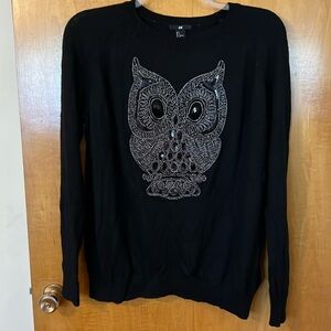 Large black sweater with bejeweled owl